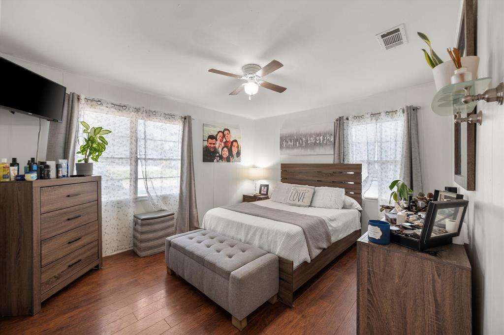 1704 Joyce Street Arlington, TX 76010 - Photo 10 of 19 a bedroom with a bed furniture and a window