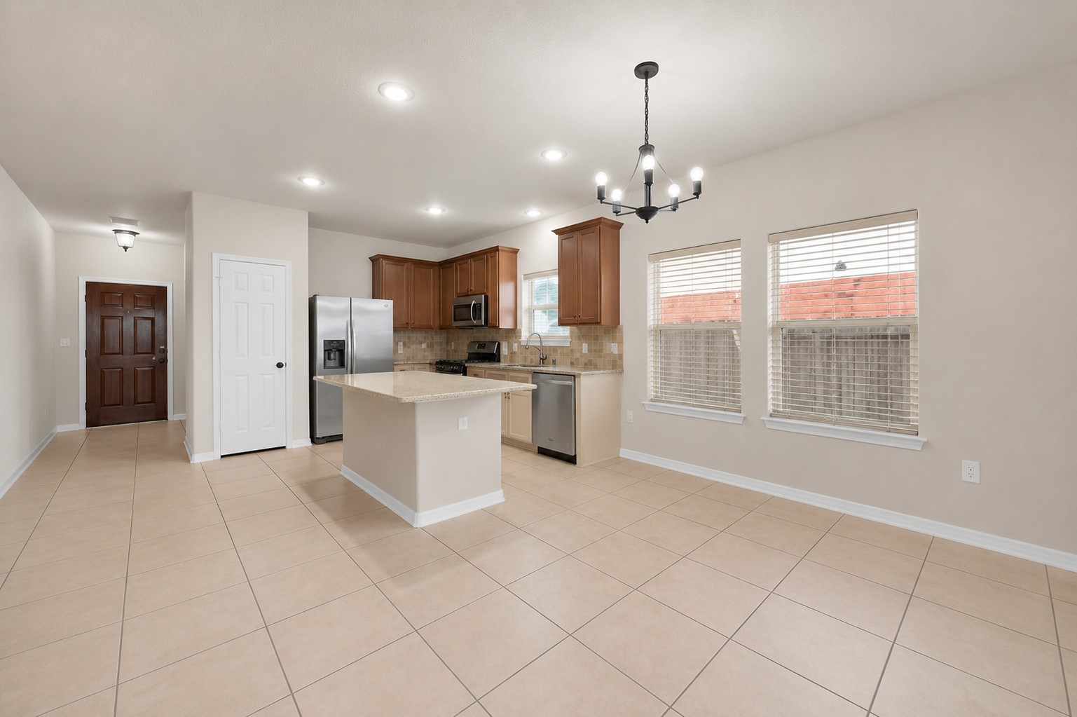 1443 Meadowhigh Lane Spring, TX 77373 - Photo 4 of 23 a large white kitchen with cabinets