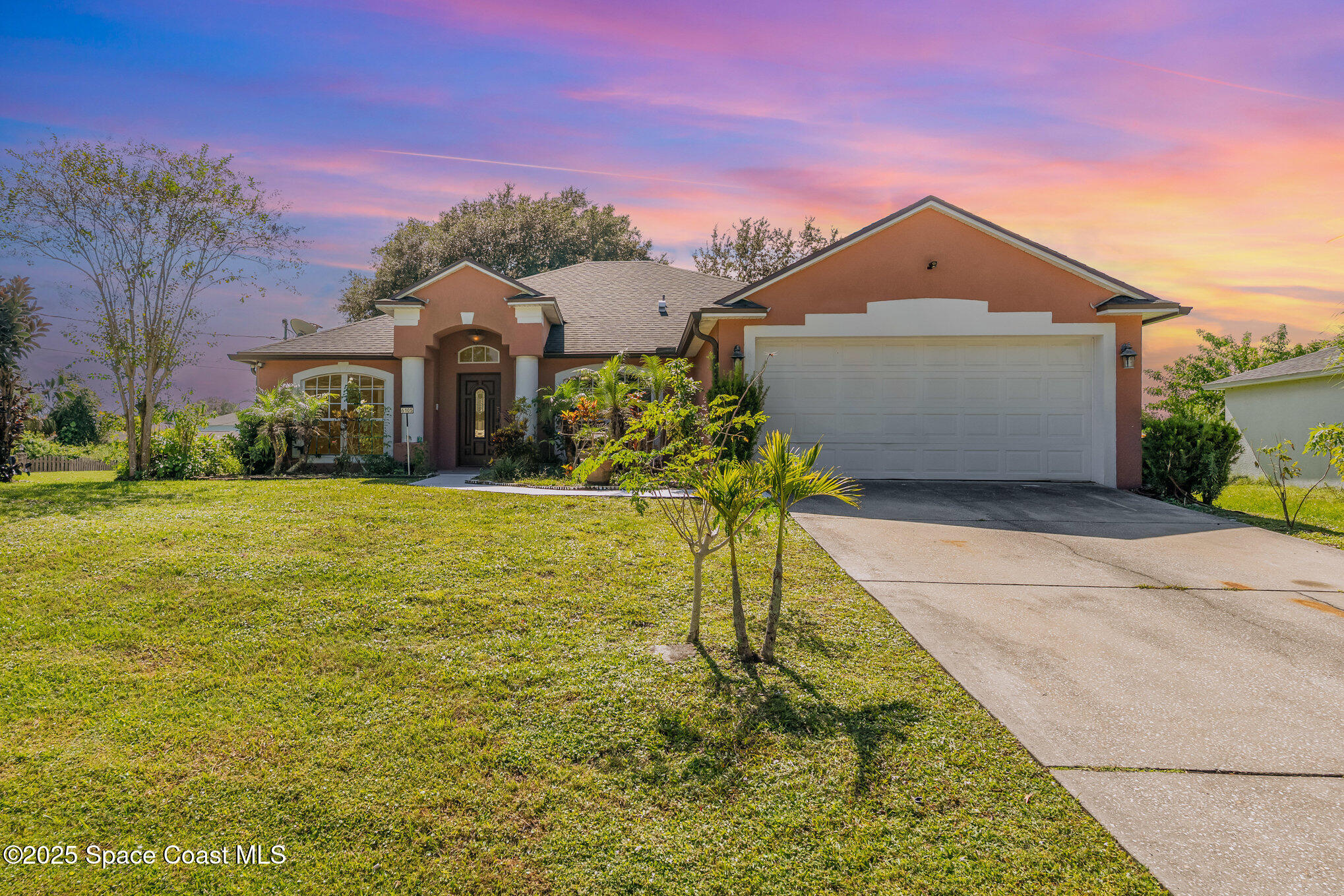 6105 Banyan Street Cocoa, FL 32927 - Photo 1 of 27 a front view of a house with a yard