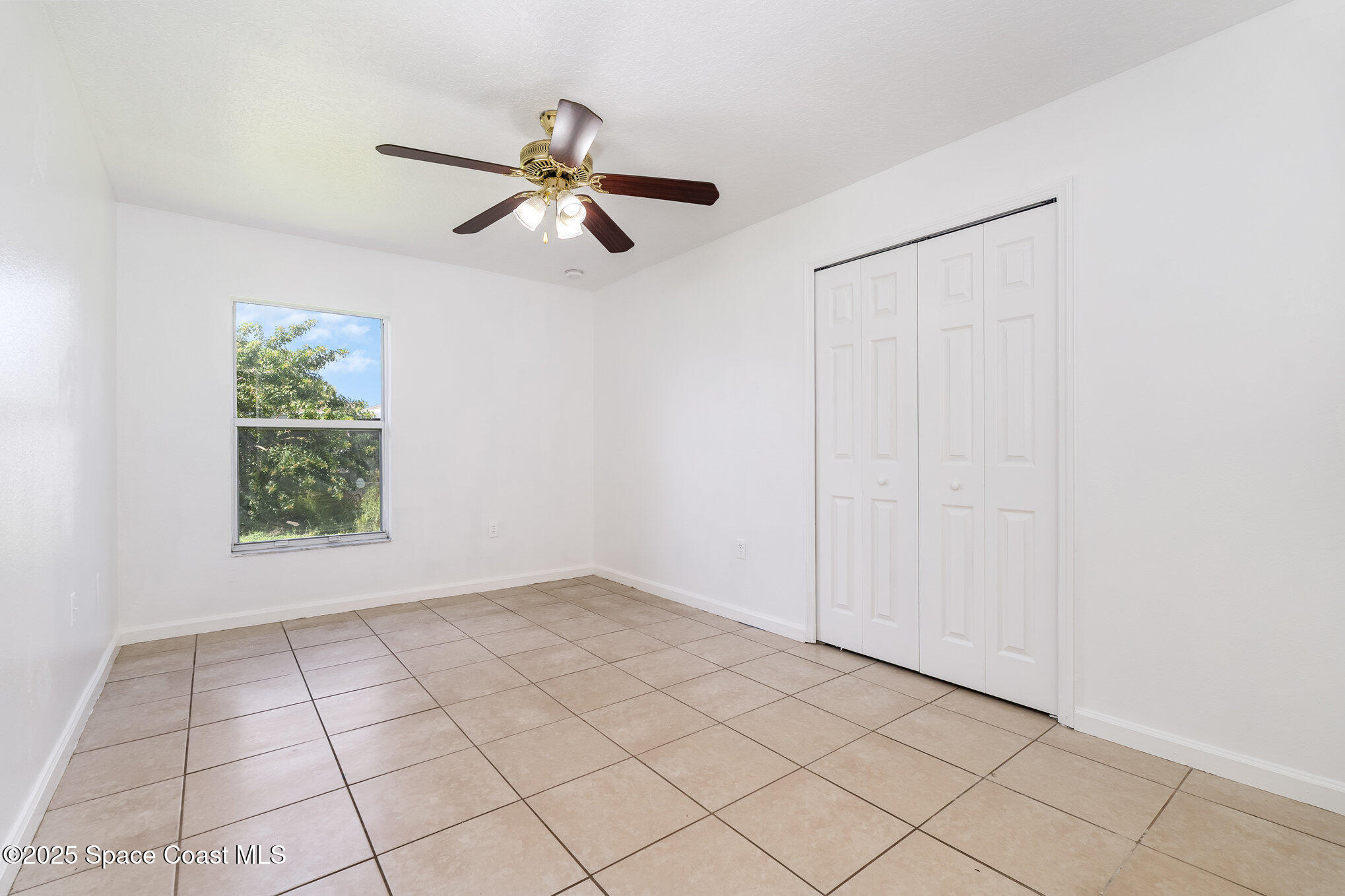 6105 Banyan Street Cocoa, FL 32927 - Photo 19 of 27 a view of an empty room and window