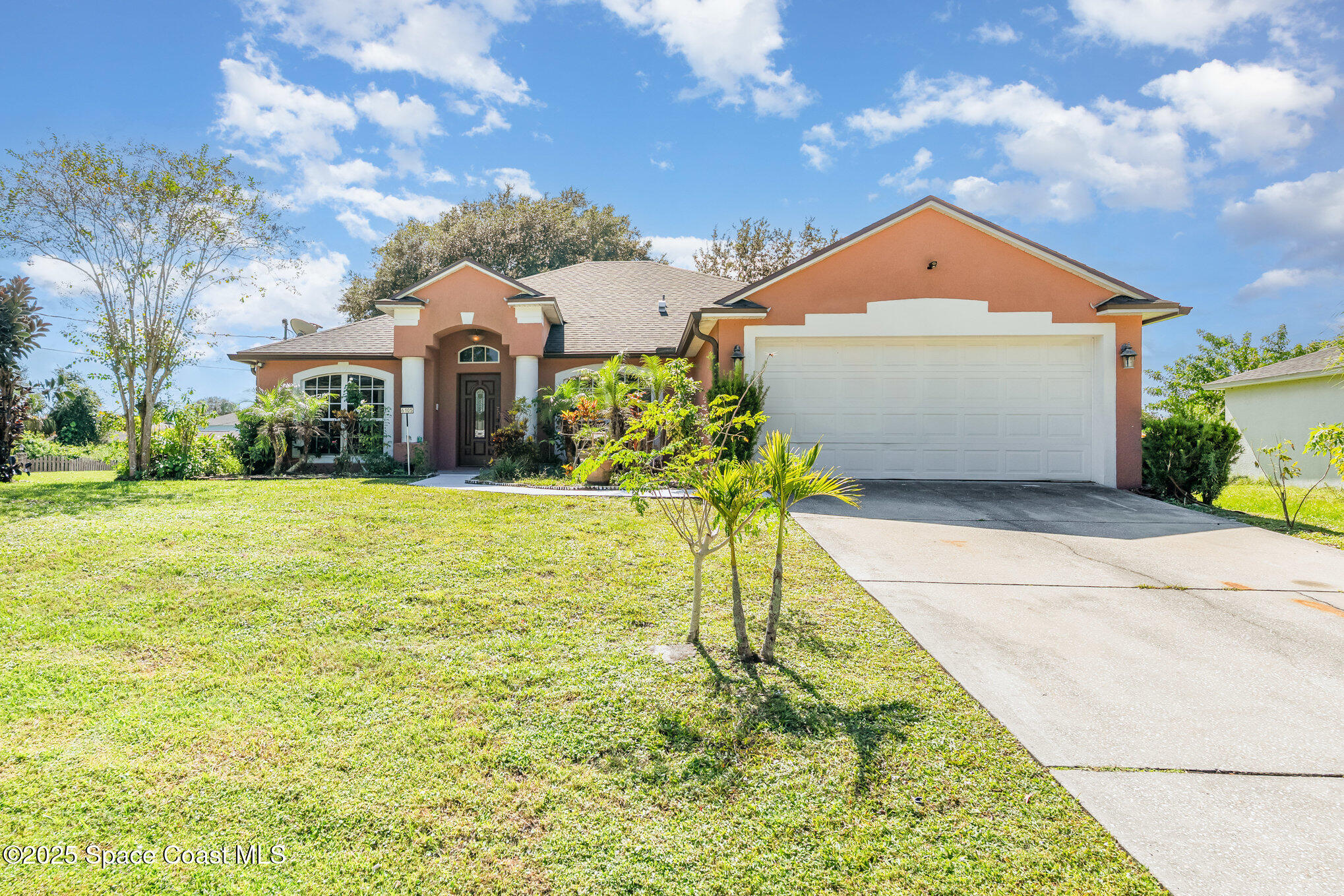 6105 Banyan Street Cocoa, FL 32927 - Photo 2 of 27 a front view of house with yard