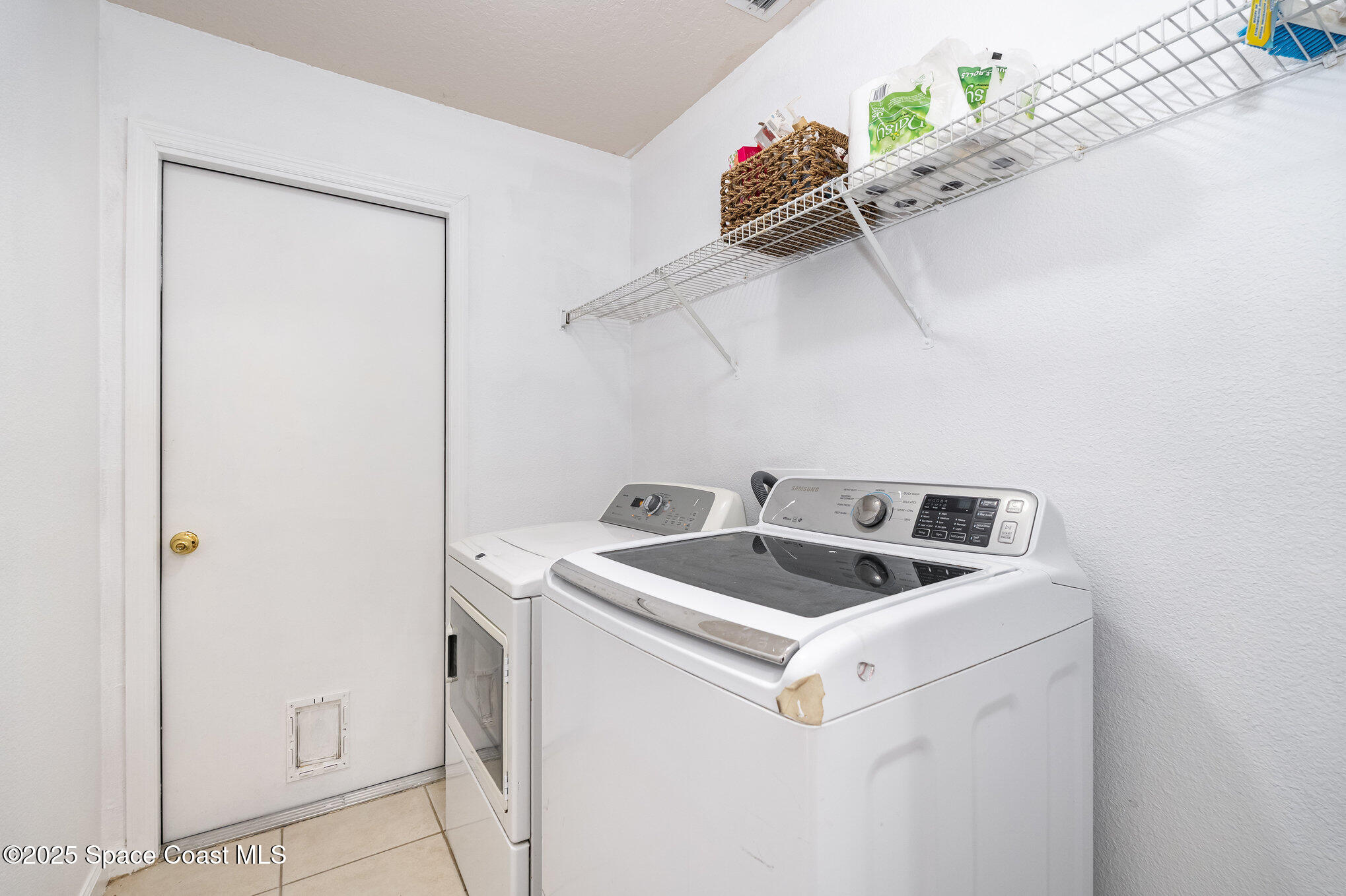 6105 Banyan Street Cocoa, FL 32927 - Photo 23 of 27 a utility room with dryer and washer