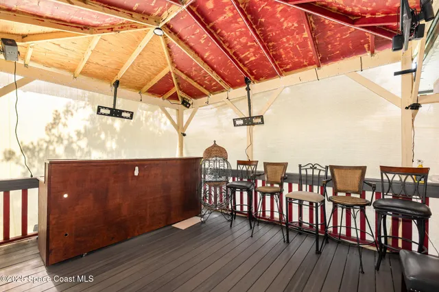 a view of balcony with furniture