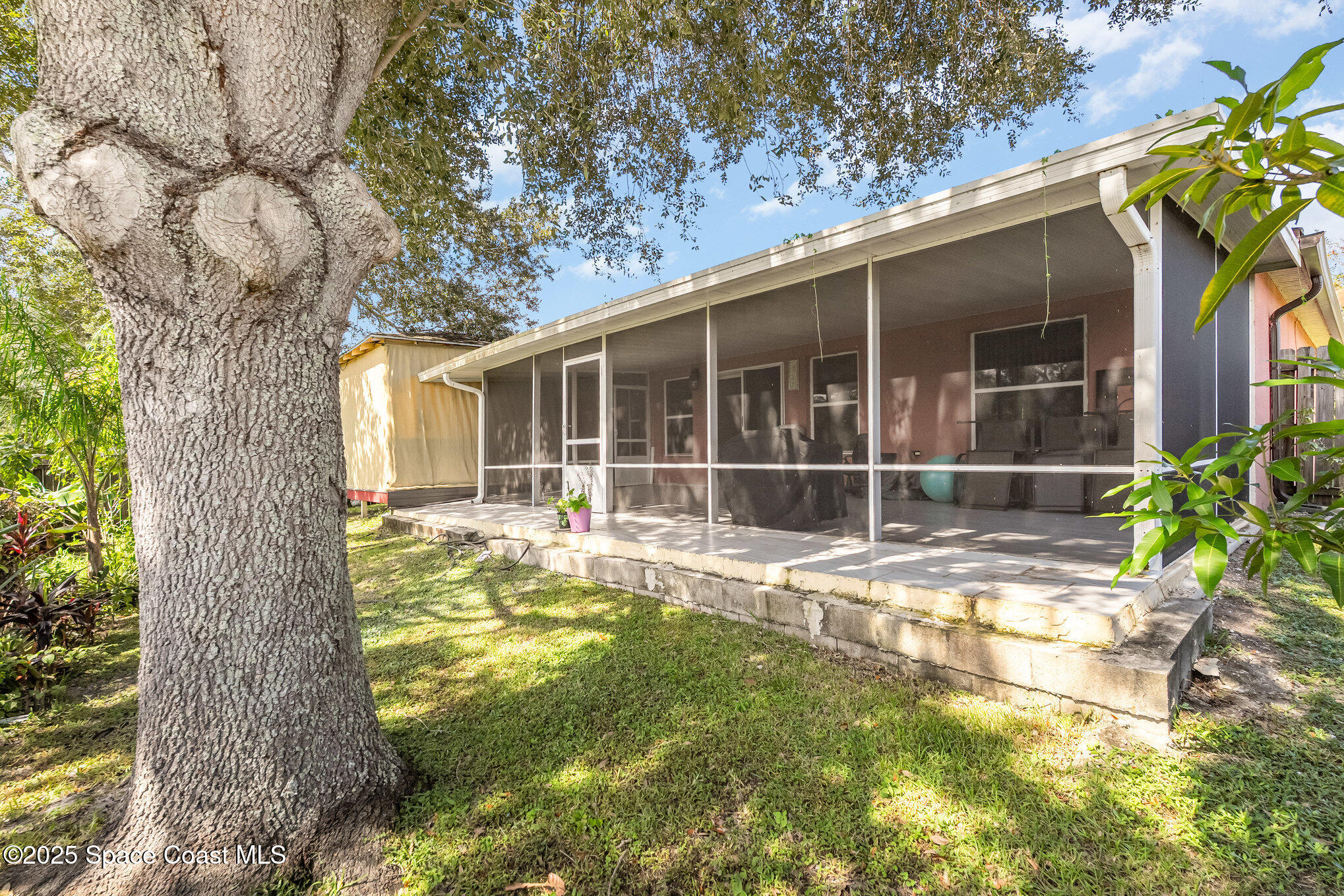 6105 Banyan Street Cocoa, FL 32927 - Photo 26 of 27 a view of a house with backyard and sitting area