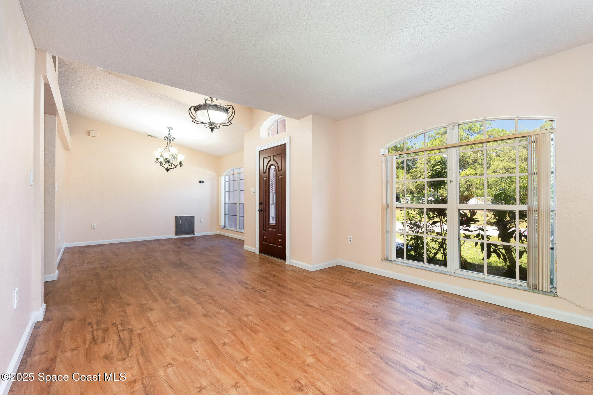 6105 Banyan Street Cocoa, FL 32927 - Photo 5 of 27 a view of an empty room with a window