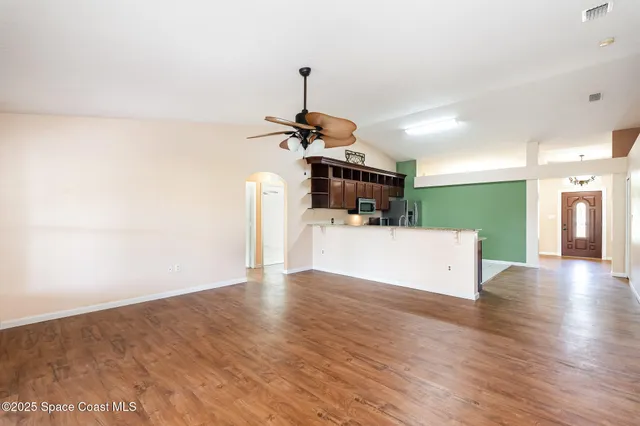 a view of a kitchen with a sink cabinet and a living room