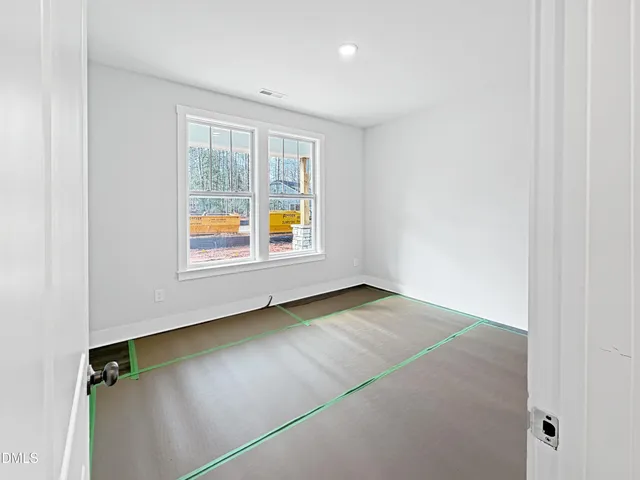 a view of room with window and ceiling fan