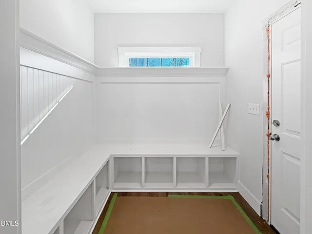 a view of hallway with wooden floor