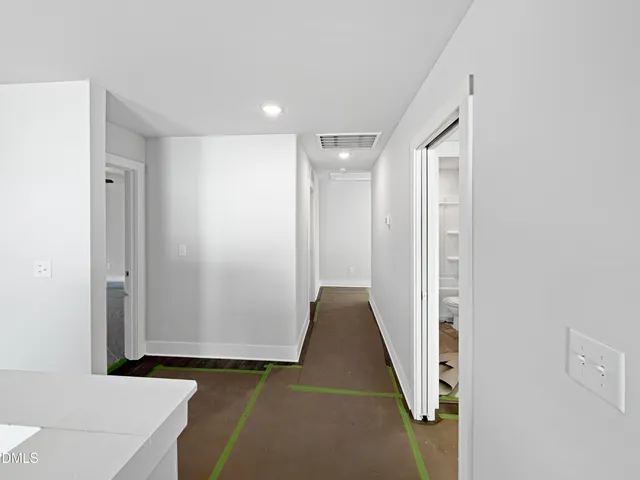 a bathroom with a sink vanity granite and a toilet