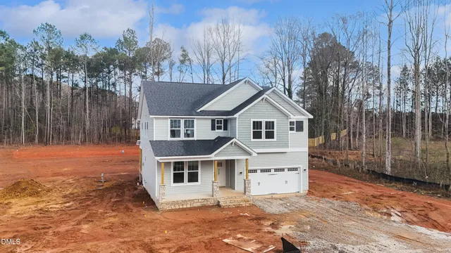 a view of kitchen with stainless steel appliances granite countertop sink and cabinets