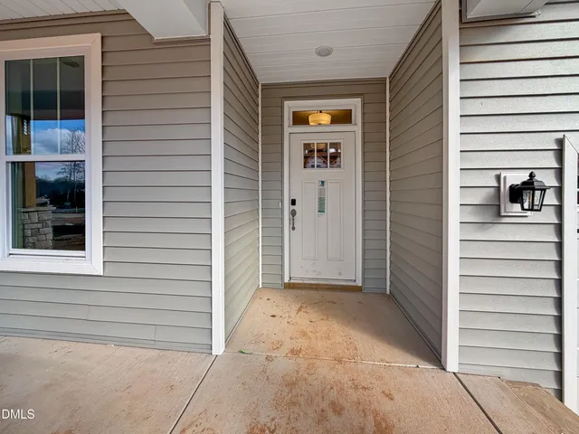 a kitchen with white cabinets and counter space