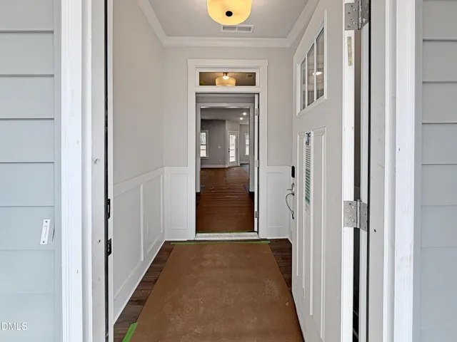 a living room with furniture and a mirror
