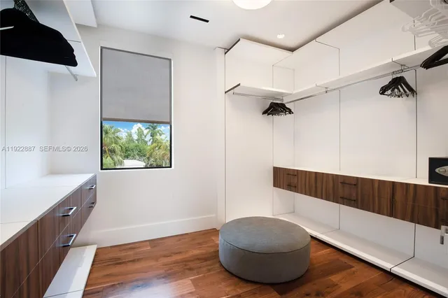 a bathroom with a double vanity sink toilet and shower