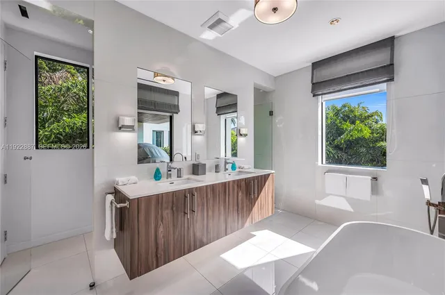 a walk in closet with white paint