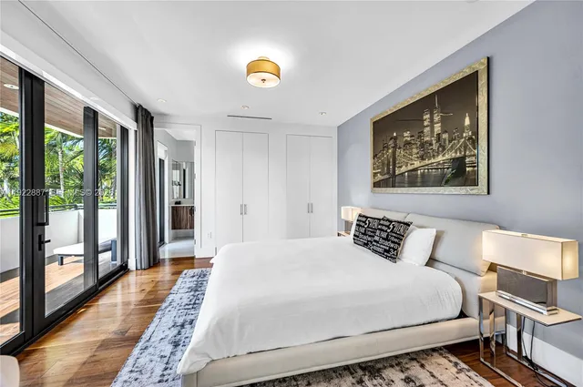 a view of a patio with couches table and chairs and potted plants