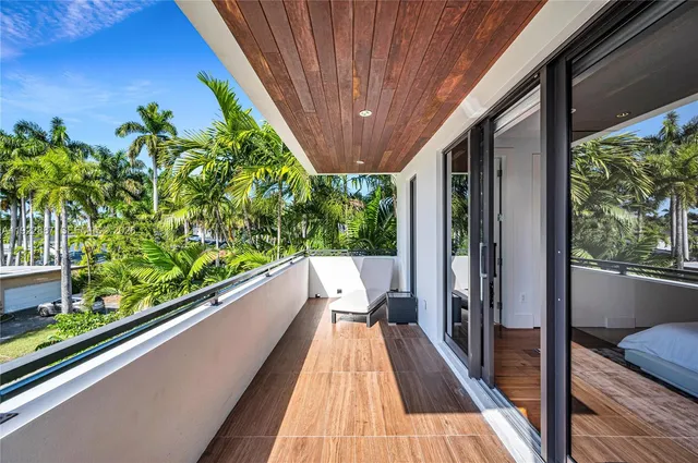 a view of a house with swimming pool and sitting area