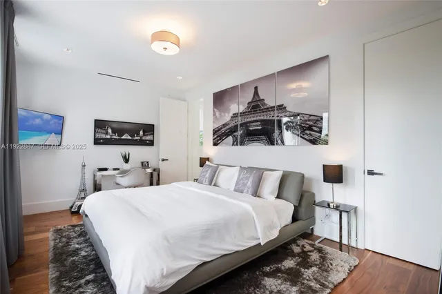 a bedroom with double bed and a night stand