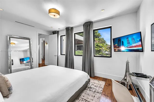 a view of a patio with couches table and chairs and potted plants
