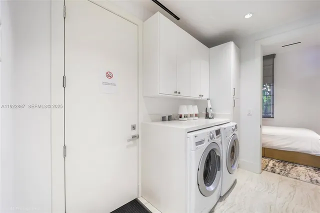 a utility room with dryer and washer