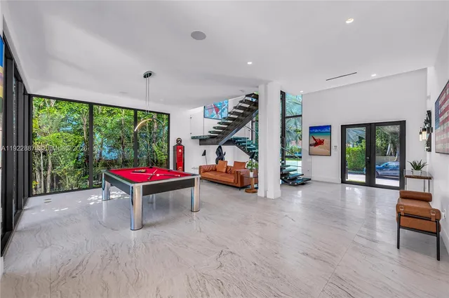 a room with furniture and a large window