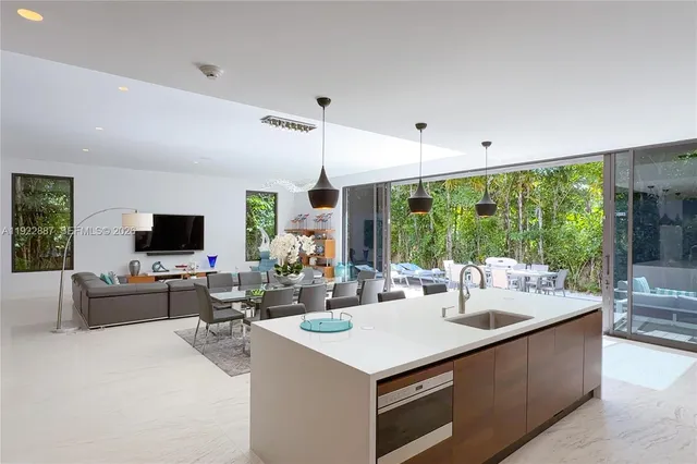 a view of a patio with couches chairs and potted plants