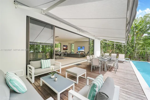 a outdoor space with patio the couches and a dining table with garden view