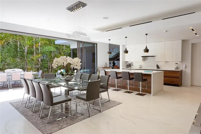 a view of a house with swimming pool and sitting area
