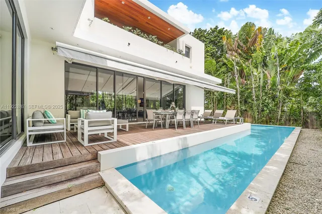 a view of a swimming pool with patio