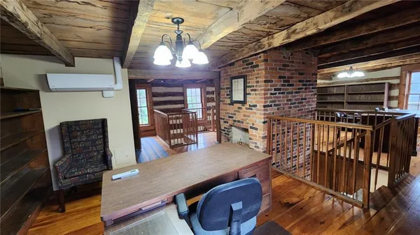 a view of a livingroom with furniture and window