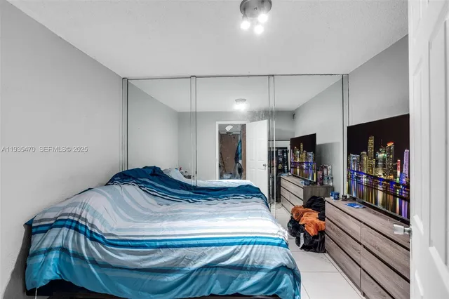 a bedroom with a bed and dresser