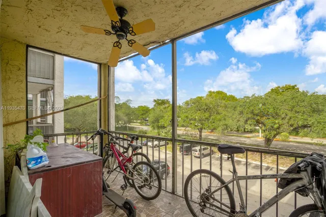 a view of a balcony with furniture