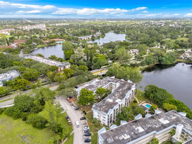 an aerial view of city and lake