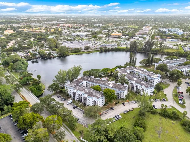 an aerial view of city and lake