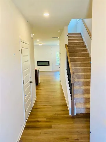 a view of bathroom with wooden floor and stairs