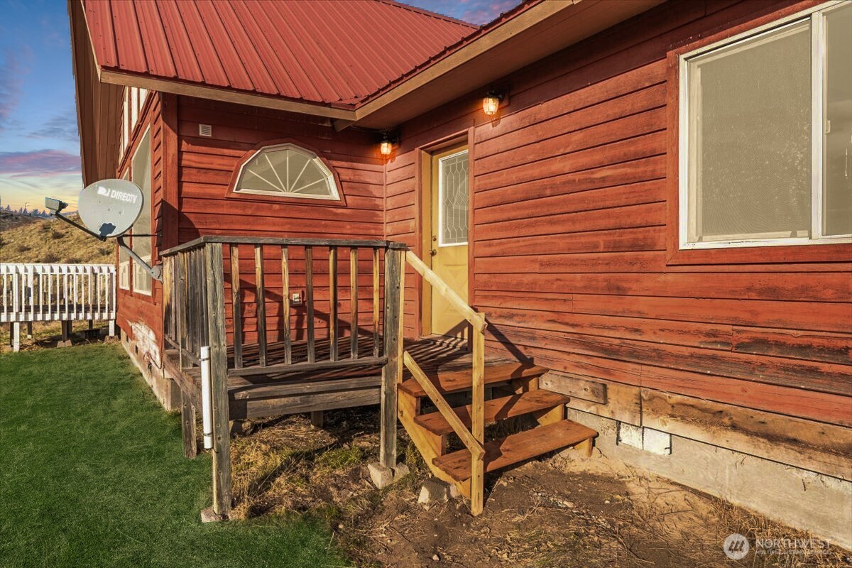 11 Pateros Fish Hatchery Road Pateros, WA 98846 - Photo 27 of 33 a view of a house with a small yard and wooden fence