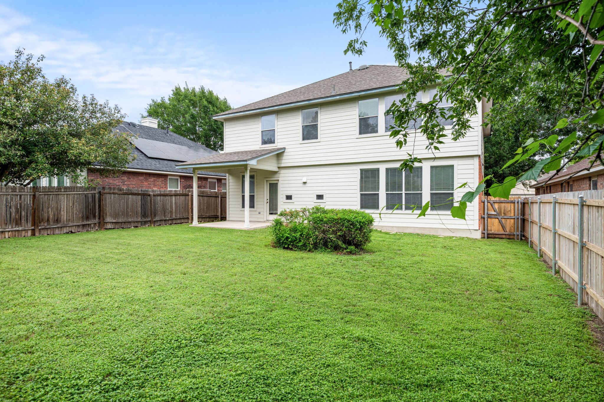 10004 Isle Royale Way Austin, TX 78747 - Photo 29 of 31 A spacious, enclosed backyard offers ample room for outdoor activities and private gatherings.