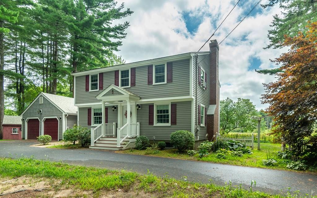 19 Willow Road Boxford, MA 01921 - Photo 1 of 32 a front view of a house with a yard and potted plants