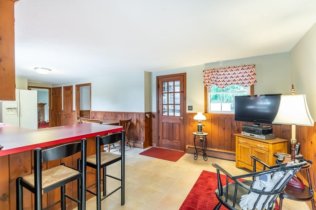 19 Willow Road Boxford, MA 01921 - Photo 12 of 32 a living room with furniture and a flat screen tv