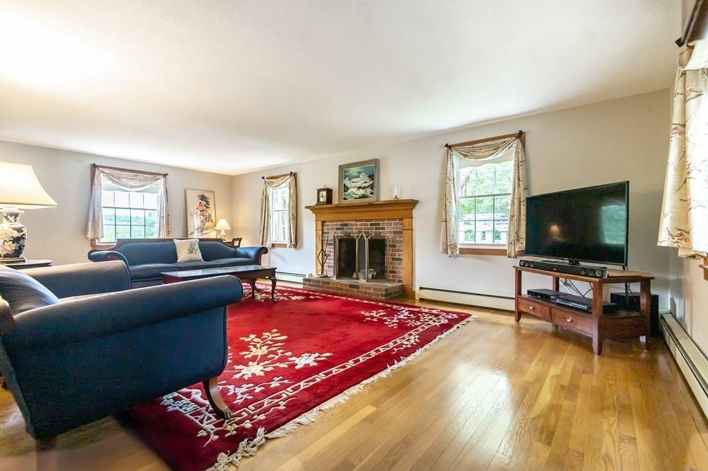 19 Willow Road Boxford, MA 01921 - Photo 15 of 32 a living room with furniture and a flat screen tv
