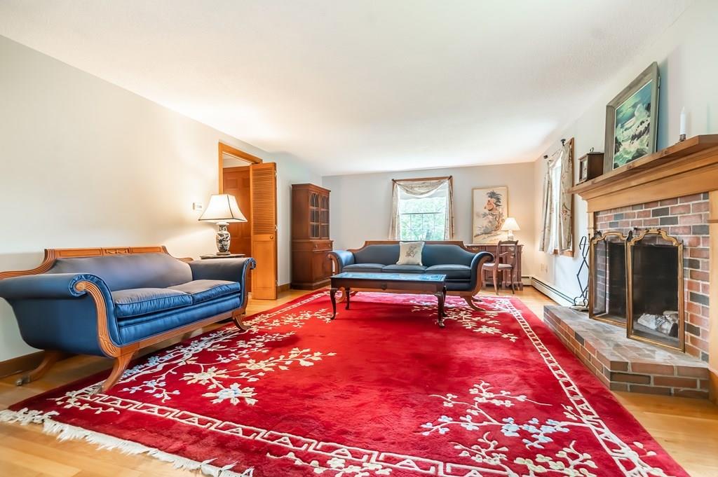 19 Willow Road Boxford, MA 01921 - Photo 16 of 32 a living room with furniture and a fireplace
