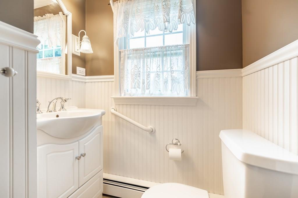 19 Willow Road Boxford, MA 01921 - Photo 18 of 32 a bathroom with a sink a toilet and a window