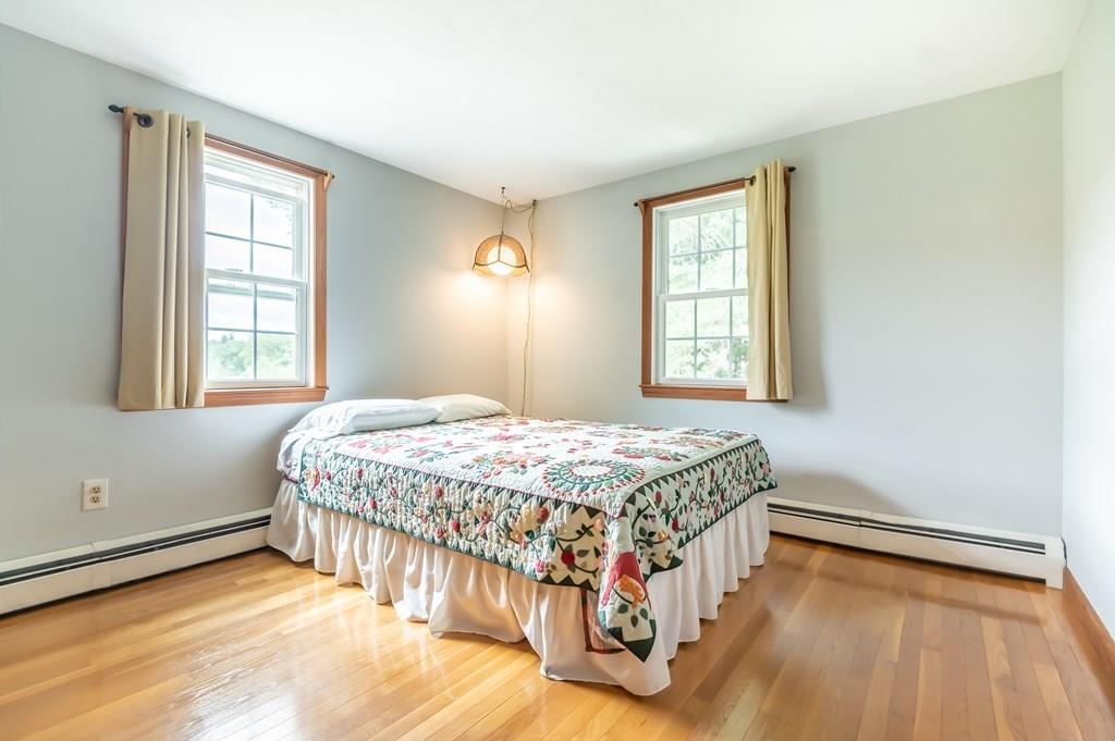 19 Willow Road Boxford, MA 01921 - Photo 21 of 32 a bedroom with a bed and a window