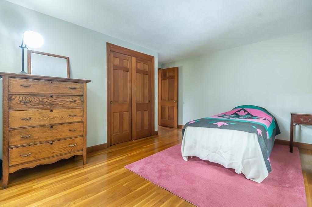 19 Willow Road Boxford, MA 01921 - Photo 23 of 32 a bedroom with a bed and a closet