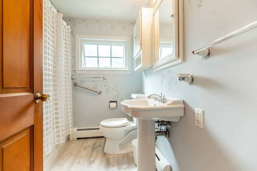 19 Willow Road Boxford, MA 01921 - Photo 24 of 32 a bathroom with a sink toilet and a shower