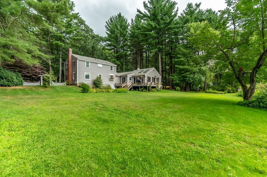 19 Willow Road Boxford, MA 01921 - Photo 29 of 32 a view of a house with a big yard and large trees