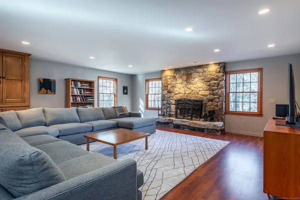 a living room with furniture and a large window