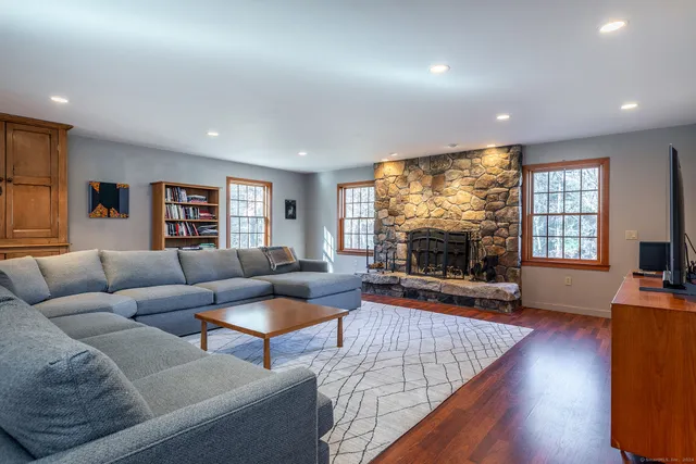 a living room with furniture and a large window
