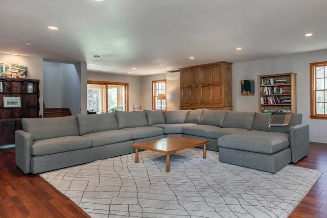 a living room with furniture and a rug