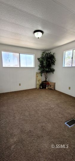 1402 North Downs Street Ridgecrest, CA 93555 - Photo 7 of 15 a view of room with window and a ceiling fan
