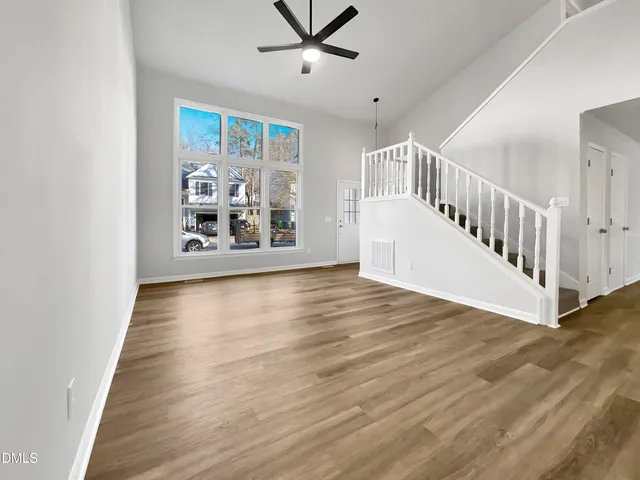 a view of an entryway with wooden floor
